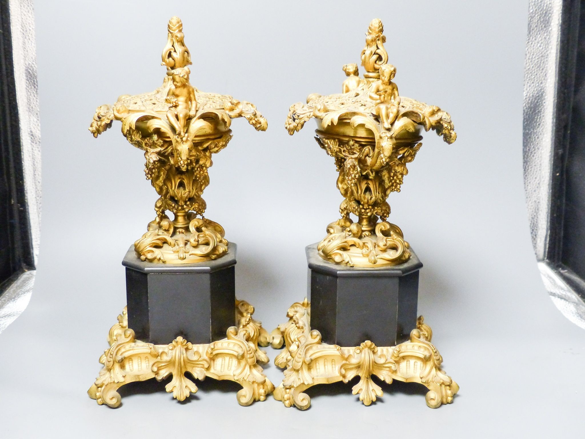 A pair of 19th century French ormolu and black marble pot pourri and covers, 34.5 cm high